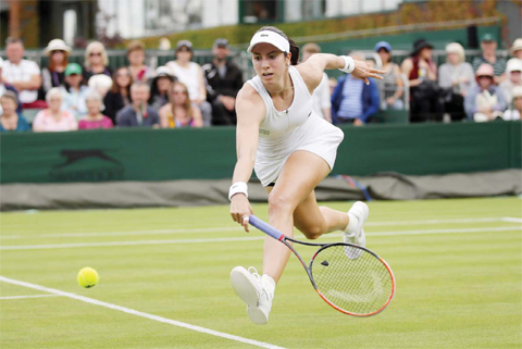 LONDON: Christina McHale of the US plays a return to Daniela Hantuchova of Slovakia during their women’s singles match on day two of the Wimbledon Tennis Championships in London, yesterday. — AP