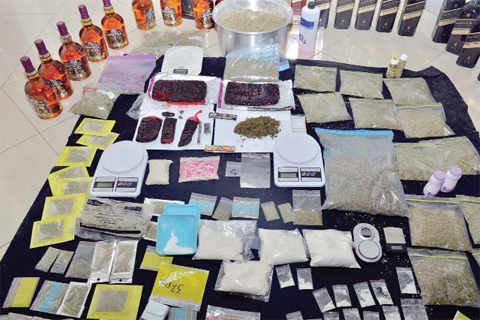 KUWAIT: This photo shows drugs and other contrabands found with four dealers who were arrested yesterday.