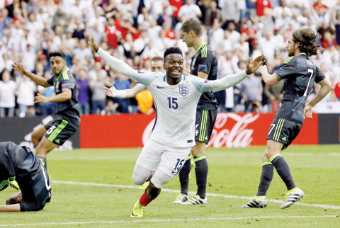 LENS: England's Daniel Sturridge celebrates after scoring his side's second goal during the Euro 2016 Group B soccer match between England and Wales at the Bollaert stadium in Lens, France, yesterday. – AP