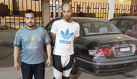 KUWAIT: This photo provided by the Interior Ministry shows two people it said were arrested yesterday on charges of impersonating as detectives and robbery.