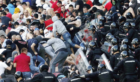 BELGRADE: In this Saturday, April 16, 2016 file photo, Serbian riot police officers clash with Red Star soccer fans during a Serbian National soccer league match between Red Star and Partizan, in Belgrade.