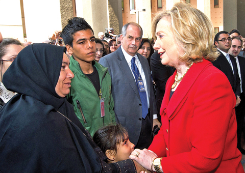 CAIRO: In this March 16, 2011 file photo, then US Secretary of State Hillary Clinton greets the family of Khairy Ramadan Ali, who was killed on Jan 28, 2011 in anti-government protests, during her visit to the US Embassy. —