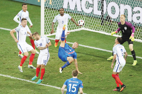 NICE: Iceland's defender Ragnar Sigurdsson (center) has an attempt on the goal during the Euro 2016 round of 16 football match between England and Iceland at the Allianz Riviera stadium in Nice on  June 27, 2016. - AFP 