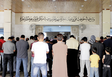 ZARQA, Jordan: In this June 19, 2016 photo, men pray inside the Al-Makhtoum mosque in Zarqa, Jordan during the funeral of Nasser Idreis, an alleged Islamic State sympathizer who died serving a three-year prison sentence. — AP