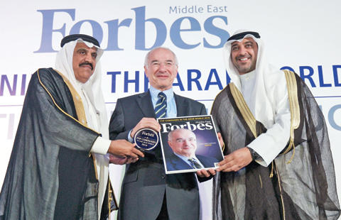 Samer Khanachet (center) receiving the award from Sheikh Mohammad Abdullah Al-Mubarak (right) and Dr Nasser Al Tayyar.