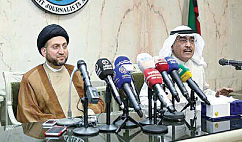 KUWAIT: Kuwait Journalists Association (KJA) Treasurer Adnan Al-Rashed (right) speaks during a press conference with leader of the Islamic Supreme Council of Iraq (ISCI) Ammar Al-Hakim, at KJA on Sunday. —Photo by Yasser Al-Zayyat
