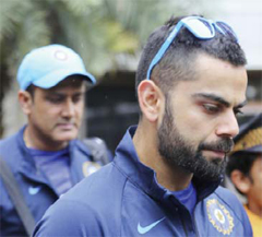 BANGALORE: Indian cricket team captain Virat Kohli and head coach Anil Kumble, left, leave after attending the first day of the team’s six-days training in Bangalore, India, yesterday. Indian team is scheduled to travel to West Indies’ to play four match test series starting July 21.— AP