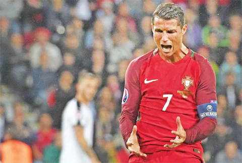 PARIS: Portugal’s forward Cristiano Ronaldo reacts after missing an opportunity on goal during the Euro 2016 group F football match between Portugal and Austria at the Parc des Princes. — AFP