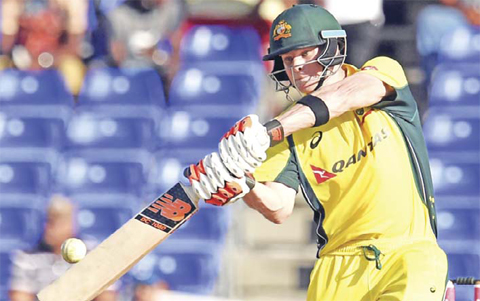 BASSETERRE: Australian cricket team captain Steven Smith plays a shot during their Tri-nation series One Day International match against South Africa at the Warner Park stadium in Basseterre, Saint Kitts, on Saturday. Australia have scored 288 runs, at the end of their innings. — AFP