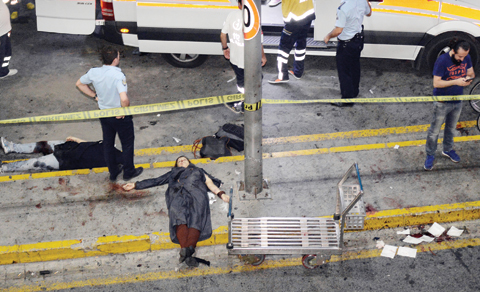 ISTANBUL: Dead victims are seen near the entrance of Istanbul’s Ataturk airport. – AP 