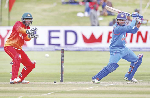 HARARE: India’s batsman Ambati Rayudu hits a shot as wicket keeper Richmond Mutumbami looks on during the second cricket match between India and hosts Zimbabwe in a series of 3 ODI games at Harare Sports Club yesterday. — AFP