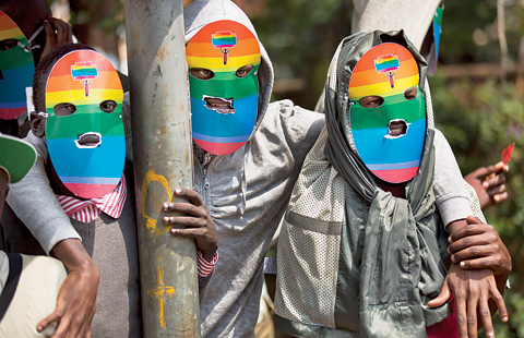 KENYA: Kenyan gays and lesbians and others supporting their cause wear masks to preserve their anonymity as they stage a rare protest. —AP