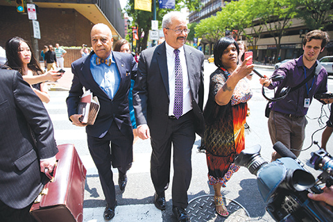 FILE - In this June 21, 2016, file photo, Rep. Chaka Fattah, D-Pa., center, leaves the federal courthouse in Philadelphia. With the Democratic National Convention looming, Philadelphia is ready with freshly swept streets, pristine hotel rooms, lavish party invitations and extra police patrols. Tougher to clean up are the recent political corruption cases that have implicated many Democrats across the state. In June, Fattah was convicted of laundering federal grants and nonprofit funds to repay an illegal $1 million campaign loan and help family and friends. (AP Photo/Matt Rourke, File)