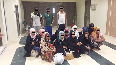 KUWAIT: This handout photo released by the Interior Ministry yesterday shows members of a gang arrested for harboring runaway maids and running illegal domestic help activities.