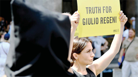 ROME: Amnesty International activists hold a flash mob yesterday in Rome’s Pantheon Square to remember late Italian student Giulio Regeni and other victims following their latest report. —AFP