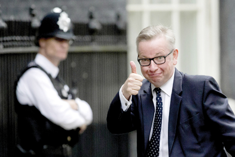 LONDON: British Secretary of State for Justice and leadership candidate for Britain’s ruling Conservative Party Michael Gove gives a thumbs-up to photographers as he arrives for a cabinet meeting at 10 Downing Street yesterday. — AP