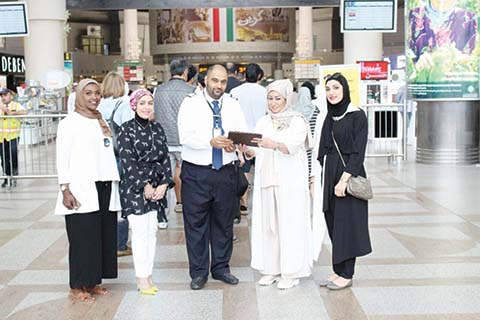 KUWAIT: Head of the MoH’s media department Ghalia Al-Mutairi (second from right)nlaunches the electronic health guide project for travelers. — KUNA