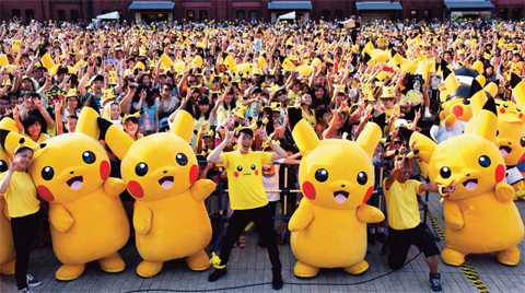 This file picture taken on August 16, 2015 shows dozens of people dressed up as Pikachu, the famous character of Nintendo’s videogame software Pokemon, dancing with fans as the final of a nine-day “Pikachu Outbreak” event in Yokohama, in suburban Tokyo. — AP/AFP photos