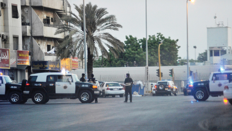 JEDDAH: Saudi policemen stand guard at the site where a suicide bomber blew himself up in the early hours of yesterday near the American consulate in the Red Sea city of Jeddah. - AFP 
