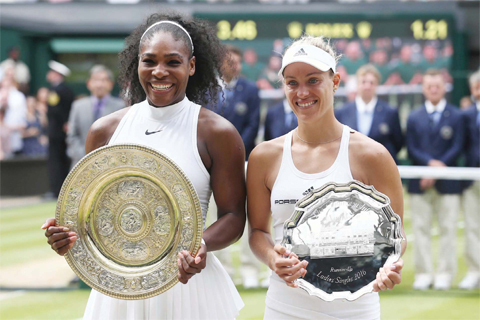 WIMBLEDON: Winner US player Serena Williams (L) poses with the winner’s trophy, the Venus Rosewater Dish, next to runner up Germany’s Angelique Kerber (R) after the women’s singles final on the thirteenth day of the 2016 Wimbledon Championships at The All England Lawn Tennis Club in Wimbledon, southwest London, yesterday. —AFP