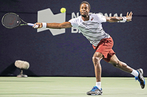 TORONTO, ON - JULY 29: Gael Monfils of France plays a shot against Milos Raonic of Canada during Day 5 of the Rogers Cup at the Aviva Centre on July 29, 2016 in Toronto, Ontario, Canada.   Vaughn Ridley/Getty Images/AFP == FOR NEWSPAPERS, INTERNET, TELCOS & TELEVISION USE ONLY ==