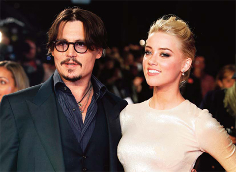 LONDON: In this Nov. 3, 2011 file photo, US actors Johnny Depp, left, and Amber Heard arrive for the European premiere of their film, “The Rum Diary,” — AP