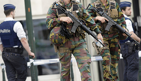 BRUSSELS: In this file photo, police and Belgian Army soldiers patrol during a court hearing for suspect Mohamed Abrini, a suspect in the Paris and Brussels attacks, that were claimed by the Islamic State organization, at the Court of Appeals in Brussels. The threat of violence by people inspired by foreign extremists invokes fear in a majority of young Americans across racial groups. —AP