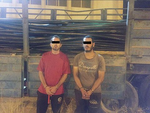 KUWAIT: This handout photo released by the Interior Ministry yesterday shows two people arrested on cable theft charges.