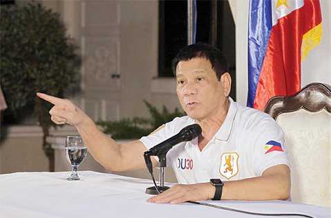 DAVAO CITY: This handout photo taken on yesterday and released by the Presidential Photographers Division (PPD) shows President Rodrigo R Duterte gesturing as he speaks during a press conference at the presidential guest house. —AFP