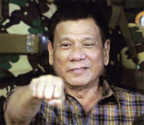 TANAY PROVINCE: In this Wednesday, Aug 24, 2016, file photo, Philippine President Rodrigo Duterte gestures with a fist bump during his visit to the Philippine Army’s Camp Mateo Capinpin. — AP