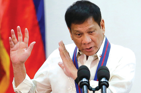 QUEZON CITY, PHILIPPINES: In this July 1, 2016, file photo, Philippine President Rodrigo Duterte gestures during the “Assumption of Command” of new Police Chief, Director General Ronald Dela Rosa at Camp Crame, Philippine National Police headquarters. —AP