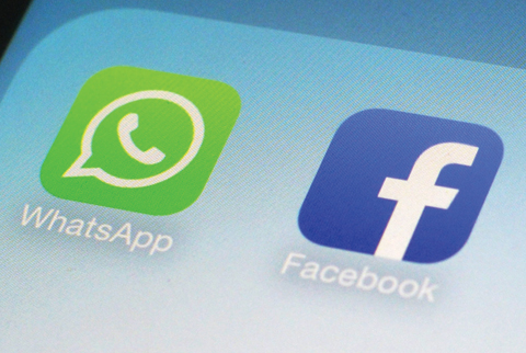 NEW YORK: This Feb. 19, 2014, file photo, shows WhatsApp and Facebook app icons on a smartphone. —AP