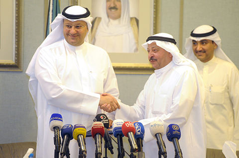 KUWAIT: Minister of Health Dr Ali Saad Al-Obaidi (left) is pictured during the signing ceremony. — KUNA