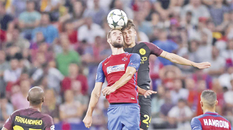BUCHAREST: Manchester City’s John Stones (right) vies with Steaua’s Alexandru Tudorie during the Champions League qualifying playoffs first leg soccer match at the National Arena Stadium in Bucharest, Romania on Tuesday, Aug 16, 2016. — AP