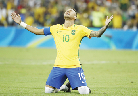 RIO DE JANEIRO: Brazil's forward Neymar celebrates scoring the winning goal during the penalty shootout of the Rio 2016 Olympic Games men's football gold medal match between Brazil and Germany at the Maracana stadium on Saturday. - AFP  