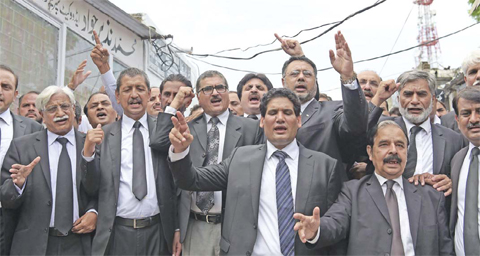 ISLAMABAD: Pakistani lawyers shout slogans against the killing of their colleagues a day after suicide bombing at the Civil Hospital in Quetta, during a protest in Islamabad yesterday. — AFP