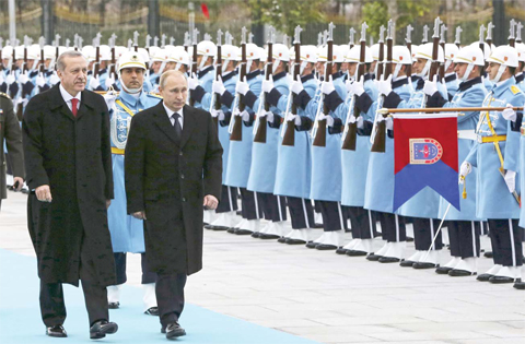 ANKARA: In this file photo, Russian President Vladimir Putin (right) and his Turkish counterpart Recep Tayyip Erdogan inspect military honor guard by Turkish Presidential Guards during a welcome ceremony at the Presidential Palace in Ankara. Erdogan heads to Russia today as part of efforts to rebuild ties shattered by Turkey’s downing of a Russian warplane. —º AP