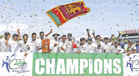COLOMBO: Sri Lankan cricketers celebrate their 3-0 test series win over Australia at the end of the third cricket test match in Colombo, Sri Lanka yesterday. — AP