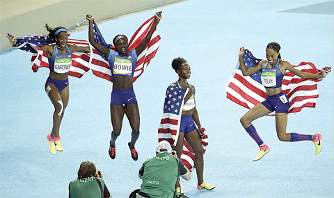 RIO DE JANEIRO: The United States team from left, English Gardner, Tori Bowie, Tianna Bartoletta and Allyson Felix celebrate winning the gold medal in the women’s 4x100-meter relay final during the athletics competitions of the 2016 Summer Olympics at the Olympic stadium in Rio de Janeiro, Brazil, Friday. —AP