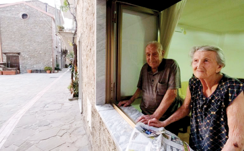ACCIAROLI: Antonio Vassallo, 100, and his wife Amina Fedollo, 93, pose for a photo at their house. — AFP