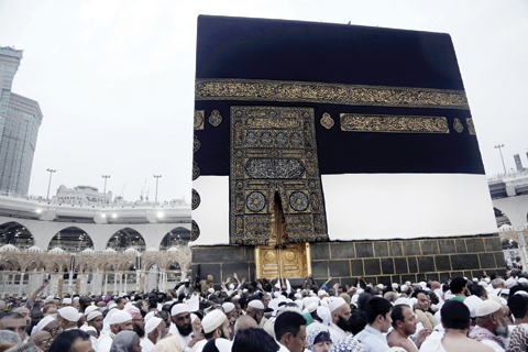 MAKKAH: Muslim pilgrims circle the Kaaba, Islam’s holiest shrine, at the Grand Mosque yesterday. — AP