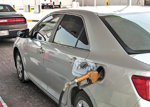 KUWAIT: A motorist buys fuel at a gas station. Kuwait government’s recent decision to make cuts to Kuwait’s petrol subsidy system is expected to boost state coffers amid low global oil prices, despite some push-back from organized labor.