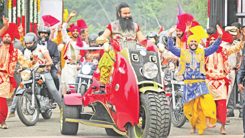 Indian spiritual guru, who calls himself Saint Dr Gurmeet Ram Rahim Singh Ji Insan, arrives for a press conference ahead of the release of his new film ‘MSG, The Warrior Lion Heart,’ in New Delhi, India. — AP photos