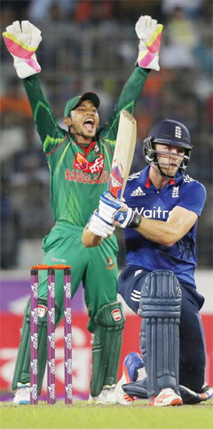DHAKA: Bangladesh’s wicketkeeper Mushfiqur Rahim, left, successfully makes an LBW appeal to dismissal of England’s David Willey, right, during their second oneday international cricket match in Dhaka, Bangladesh, yesterday. —AP