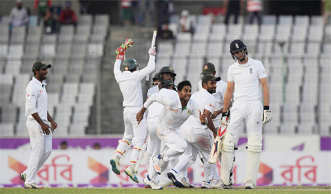 DHAKA: Bangladesh’s Mehedi Hasan (C) celebrates with teammates after winning on the third day of the second Test cricket match Bangladesh and England at the Sher-e-Bangla National Cricket Stadium in Dhaka yesterday. Bangladesh won the match by 108 runs and leveled the twomatch Test series 1-1. — AFP