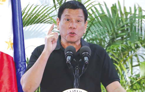 DAVAO, PHILIPPINES: Philippines President Rodrigo Duterte delivers a speech at the Davao international airport terminal building early on September 30, 2016, shortly after arriving from an official visit to Vietnam.—AFP