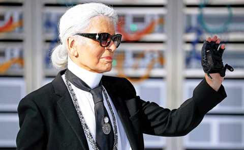 German fashion designer Karl Lagerfeld acknowledges the audience at the end of the Chanel 2017 Spring/Summer ready-to-wear collection fashion show yesterday in Paris. — AFP