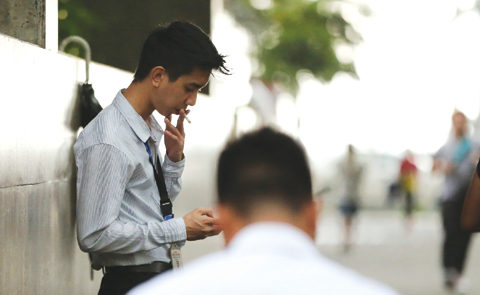 MANILA, PHILIPPINES: A Filipino smokes a cigarette on Tuesday, Oct. 11, 2016. —AP