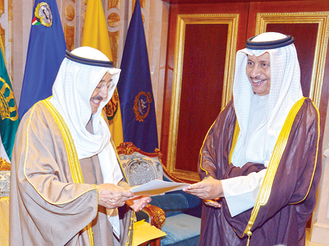 KUWAIT: HH the Prime Minister Sheikh Jaber Al-Mubarak Al-Hamad Al-Sabah (right) submits the Cabinet’s resignation to HH the Amir Sheikh Sabah Al-Ahmad Al-Jaber Al-Sabah at Bayan Palace yesterday. —- KUNA