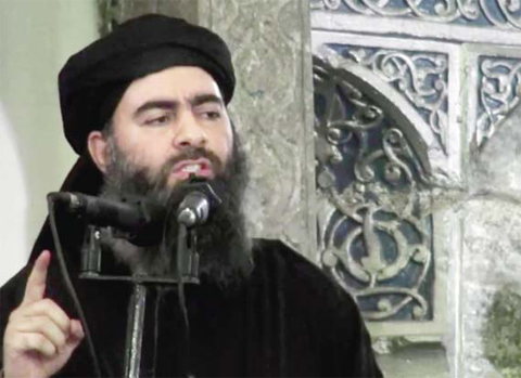 This file image made from video posted on a militant website on July 5, 2014, purports to show the leader of the Islamic State group, Abu Bakr Al-Baghdadi. — AP